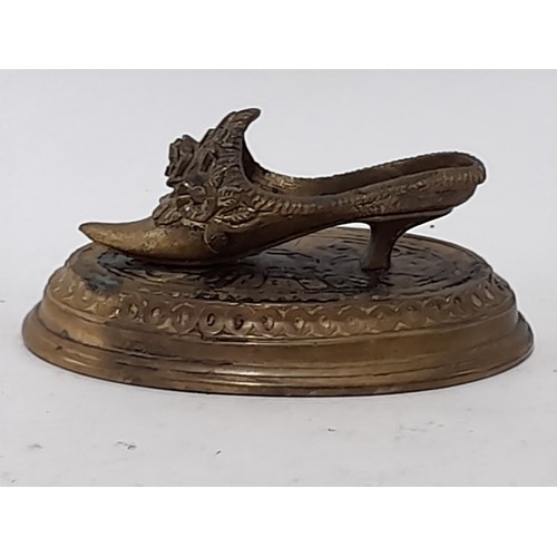 63 - Brass Shoe on a Plinth, 11.5cm long x 6cm high