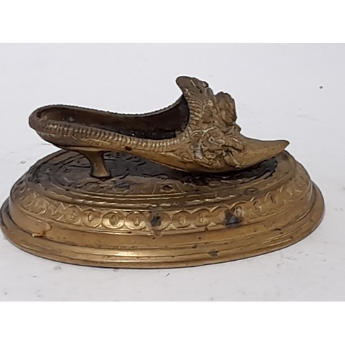 63 - Brass Shoe on a Plinth, 11.5cm long x 6cm high