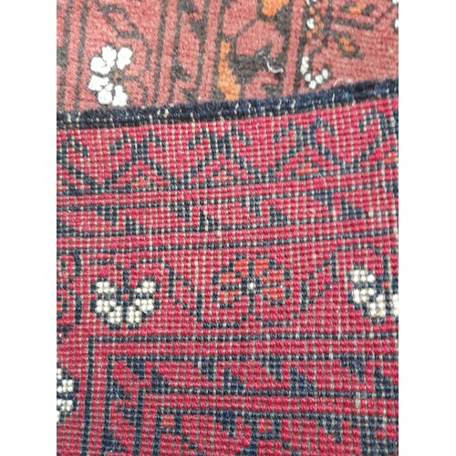 90 - Red ground rug 96cm x 53cm