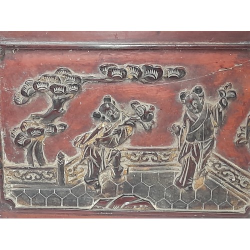 121 - Wood carved panel depicting an Oriental couple on a bridge, 33cm x 22cm