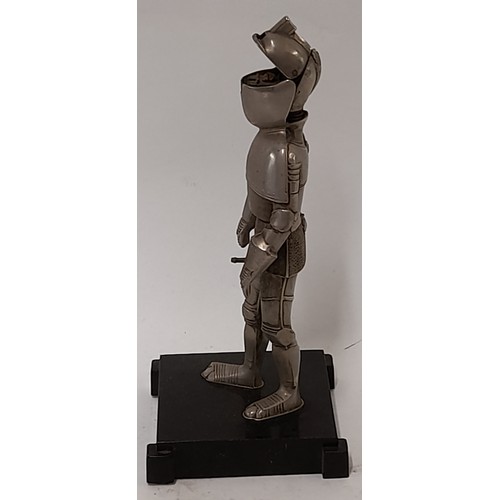 122 - Vintage Table Cigarette Lighter in the form of a Knight standing on a plinth, 17cm high