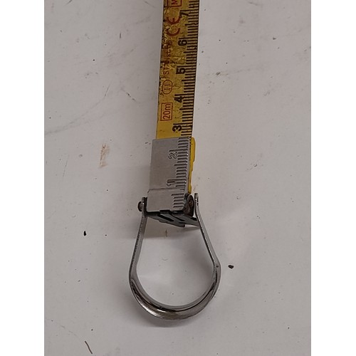 124 - Vintage Stanley  20mt Steel retracting tape measure with metal frame and retracting wind in handle