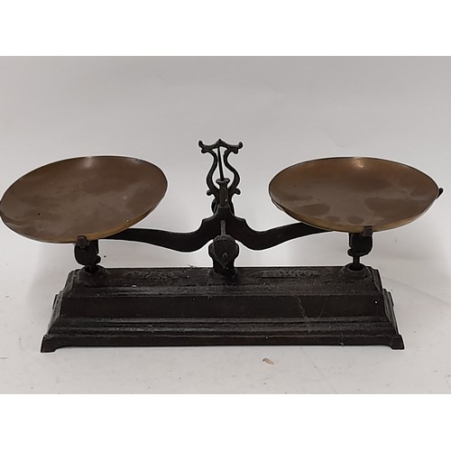 166 - Small Set of Scales with cast iron base and 2 Brass dishes, 34cm wide x 16cm high