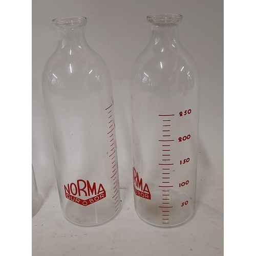 194 - 4 x NORMA Dur o Bor Glass bottle with measurement Scale, 17cm high