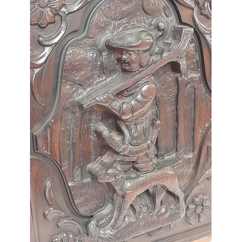 197 - Deeply Carved wood  Panel of a Huntsman and his dog, 37cm x 48cm