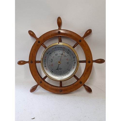 207 - Barometer in the form of a ships wheel, 42cm wide