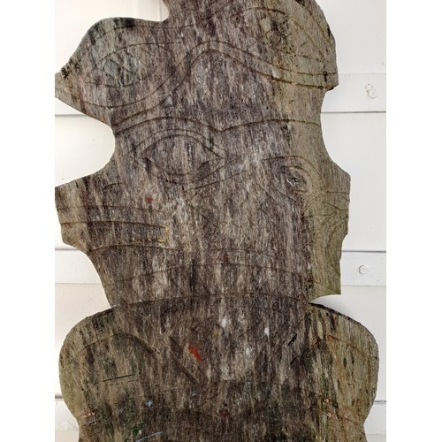 209 - Carved and shaped plank of wood possibly South Asian with signs of original paint. 145cm x 42cm