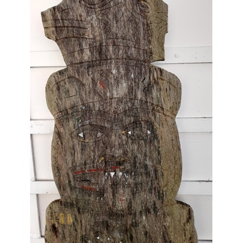 209 - Carved and shaped plank of wood possibly South Asian with signs of original paint. 145cm x 42cm