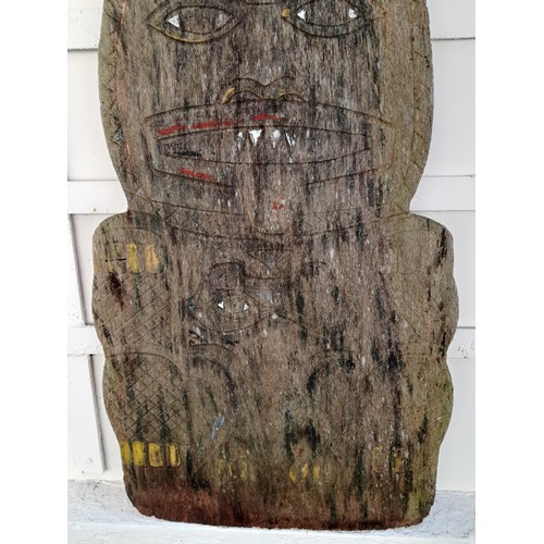 209 - Carved and shaped plank of wood possibly South Asian with signs of original paint. 145cm x 42cm