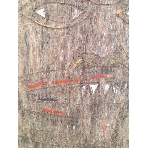 209 - Carved and shaped plank of wood possibly South Asian with signs of original paint. 145cm x 42cm