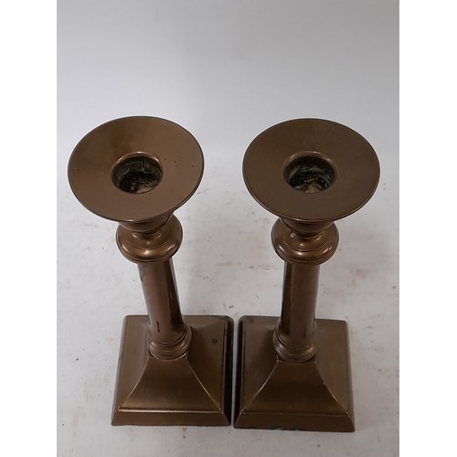 133 - Brass Candlestick, 19.5cm high on square base, 7cm x 7cm