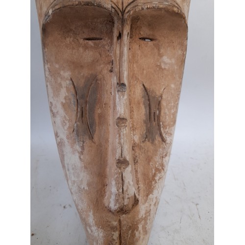 565 - Tribal Hand carved Face Mask painted White, 54cm x 21cm