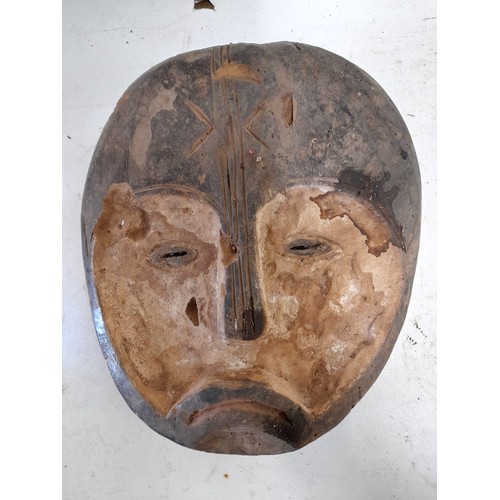 569 - Tribal Hand carved Face Mask oval with Sad Face 31cm x 26cm