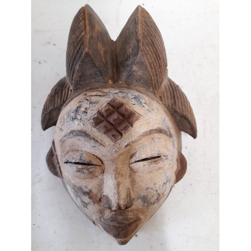 570 - Tribal Hand carved Face Mask with white face, 28cm x 21cm