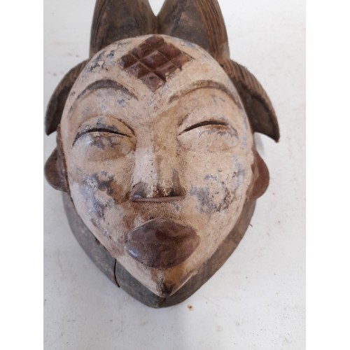 570 - Tribal Hand carved Face Mask with white face, 28cm x 21cm