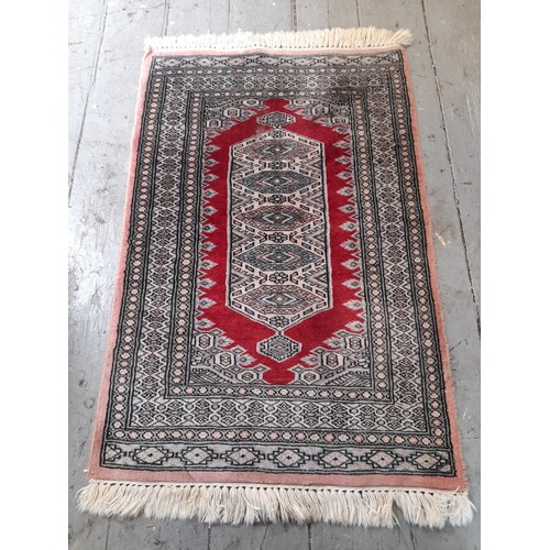 13A - Oriental Blue Ground Rug with central pattern, 96cm x 64cm