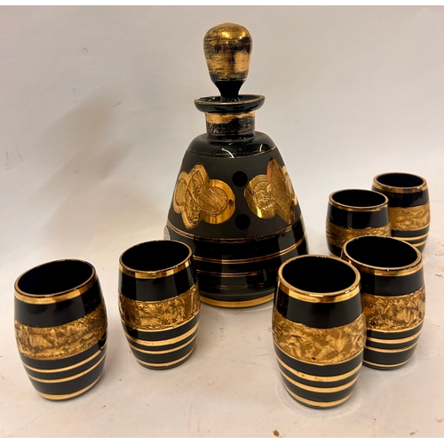 262 - Vintage Black And Gold Decorative  Six Glasses And One Decanter. Largest 18cm x 10cm.  (7)