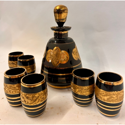 262 - Vintage Black And Gold Decorative  Six Glasses And One Decanter. Largest 18cm x 10cm.  (7)