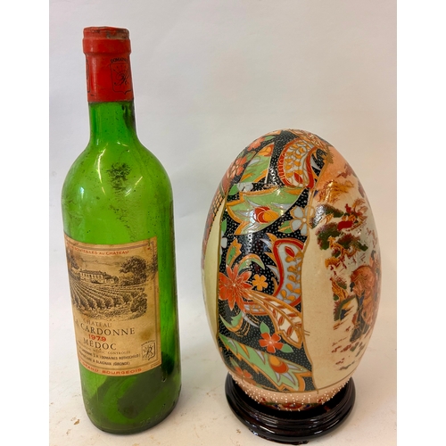 270 - Decorative Oriental Ceramic Hand painted Egg On Wooden Plinth. 24cm x 13cm.