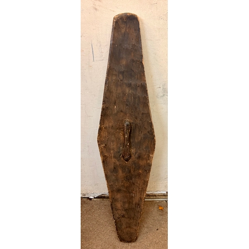 450 - Large Decorative Wooden Tribal Shield. 111cm x 28cm.