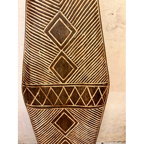 450 - Large Decorative Wooden Tribal Shield. 111cm x 28cm.