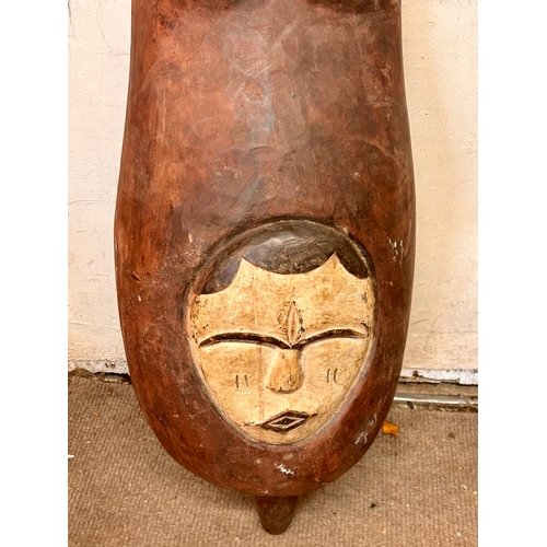 457 - Wooden Decorative Tribal Belly Mask. 109cm x 35cm x 23cm.