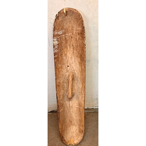 458 - Large Tribal Wooden Decorative Hand Held  Shield. 130cm x 26cm x 14cm