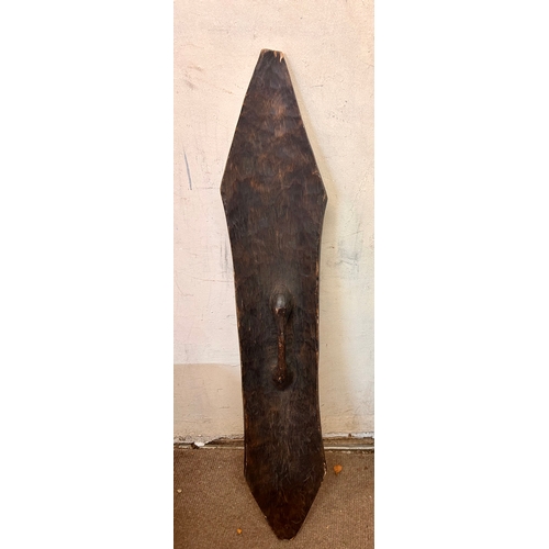 471 - Tribal Decorative Wood Hand Held Shield From Cameroon . 120cm x 20cm.