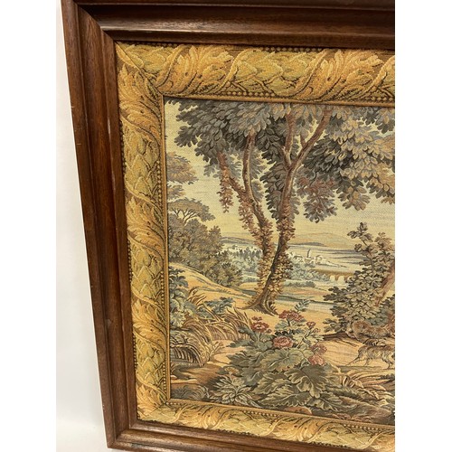 340 - Continental Framed Tapestry Of Countryside Shooting Scene. 107 x 65 cms