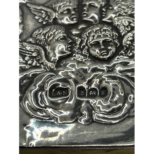 424 - Silver Hallmarked Cherub Decorated Prayer Book.