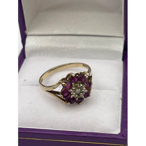 434 - 9ct Gold Hallmarked Ruby And Diamond Flower Ring. 2.3g Size M 1/2.