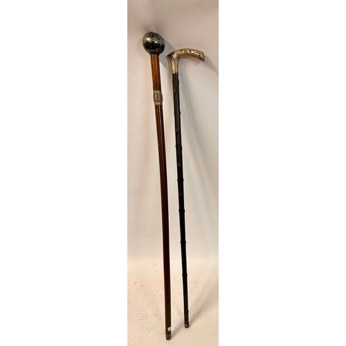 509 - Two Interesting Walking Sticks, One With Heavy Ball Finial And The Other Decorative Silver Coloured ... 