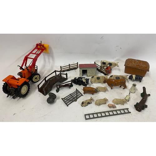 585 - Quantity Of Metal Farm Animals Along With A Vintage Tractor.