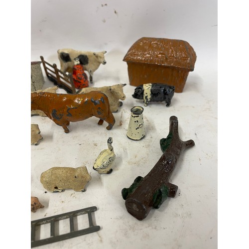 585 - Quantity Of Metal Farm Animals Along With A Vintage Tractor.