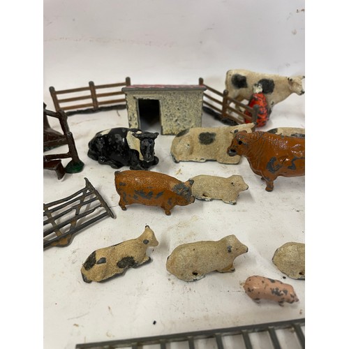 585 - Quantity Of Metal Farm Animals Along With A Vintage Tractor.