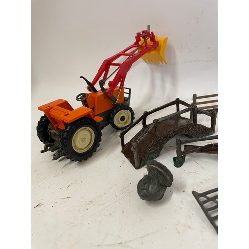 585 - Quantity Of Metal Farm Animals Along With A Vintage Tractor.