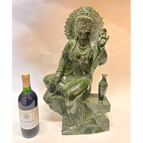 589 - A Large Chinese Dark Green Jade Seated Figure Of Guanyin Holding A Umbrella And Beads. 53 x 31 x 22 ... 