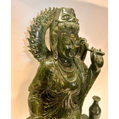 589 - A Large Chinese Dark Green Jade Seated Figure Of Guanyin Holding A Umbrella And Beads. 53 x 31 x 22 ... 