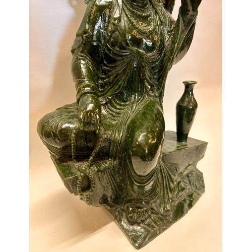 589 - A Large Chinese Dark Green Jade Seated Figure Of Guanyin Holding A Umbrella And Beads. 53 x 31 x 22 ... 