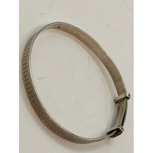 27 - Two Silver Decorative Pinch Bracelets. Largest 6cm Circular.  (2)