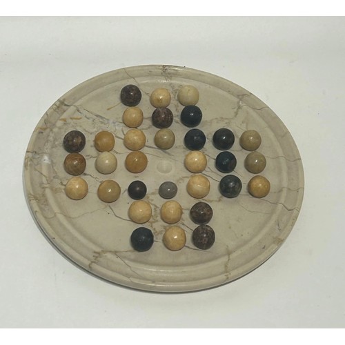 31 - Marble solitaire game . Measures 23cm