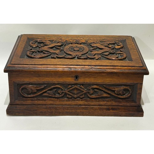 42 - Oak decorative hand carved box. With lock. (Key missing) Measures 35cm long x 21.5cm deep x 13.5cm h... 