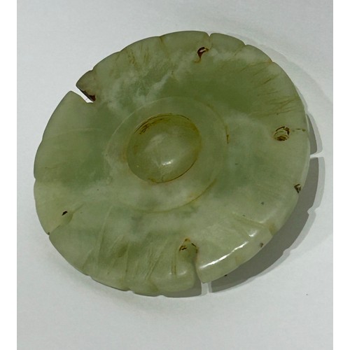 43 - Chinese Jade/Jadeite carved coin amulet. Measures 5cm diam.