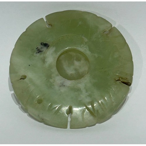 43 - Chinese Jade/Jadeite carved coin amulet. Measures 5cm diam.