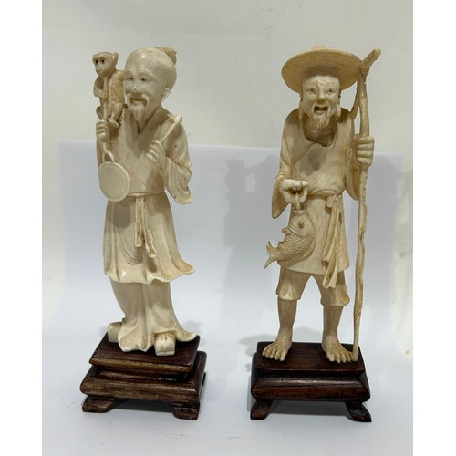 48 - Two Chinese Bone figures on wooden bases. Both male. One fisherman and one other. Both measure 15 Cm... 