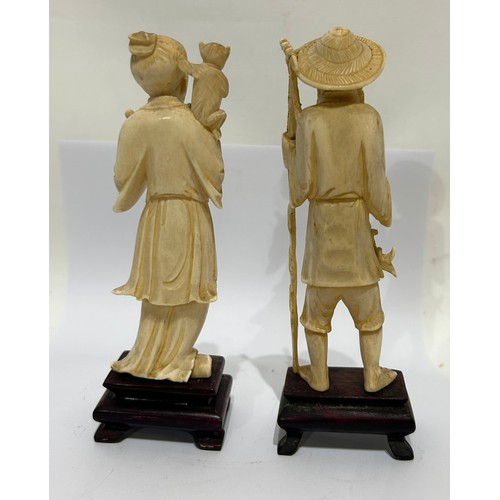 48 - Two Chinese Bone figures on wooden bases. Both male. One fisherman and one other. Both measure 15 Cm... 