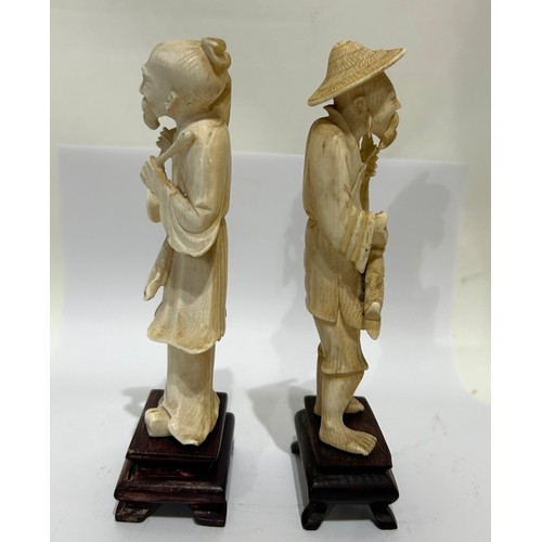 48 - Two Chinese Bone figures on wooden bases. Both male. One fisherman and one other. Both measure 15 Cm... 