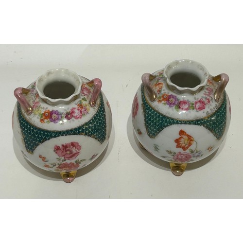 38 - Pair of Floral design China potbelly vases with hatch mark to base. Measures 10cm high x 11cm diam. ... 