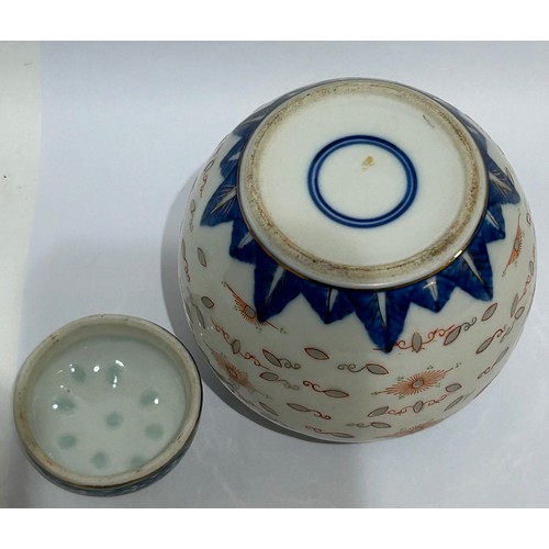 44 - Blue and white Oriental ginger jar/vase. Measures 11cm high x 11cm at its widest