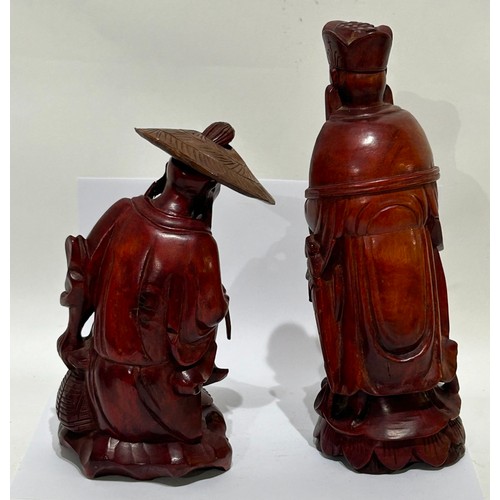 201 - Two Asian/Japanese carved wooden Figures. One with removable hat. Tallest measuring 20cm high, other... 